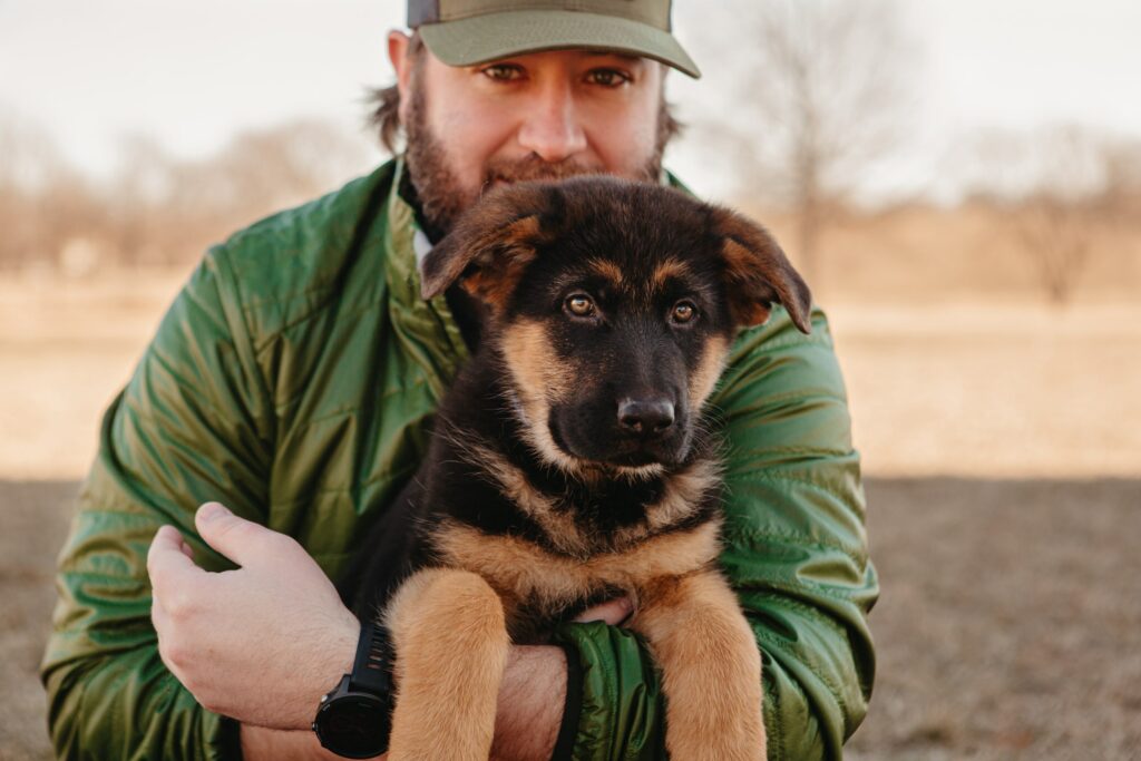 Patrick holding his dog.